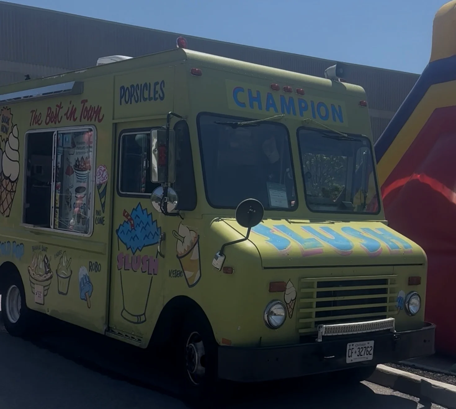 The Champion Ice Cream truck, front view, parked at an event
